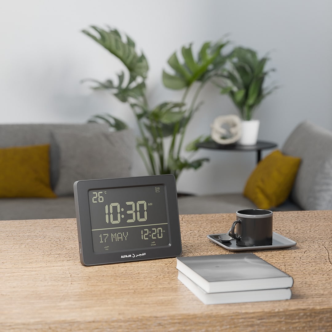 azan digital clock on table