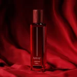 Perfume bottle of Wanted lady from Assaf on red fabric