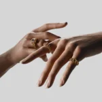 Close up hand modeling luxury gold rings detailed jewelry product presentation