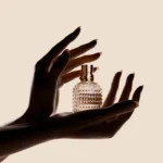 Valentino textured perfume bottle in hand modeling photo